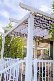 White Striped Fabric Cableshades On White Wood Pergola Patio Shade Patio Shade Covers Pergola Shade