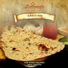 Garlic Naan An Indian Bread Served To You At The Maharaja With Any Delicious Curry Of Choice Made With Maida And More Indian Bread Bread Serving Garlic Naan