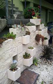 They are easy to work with and available at your local store. Cement Block Plant Flower Wall Cinder Block Garden Wall Cinder Block Garden Home Landscaping