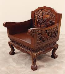 The back consists of multiple thin spindles that connect to a solid, sculpted wooden seat and an arched or straight top piece. Chair Wood Carving Wood Carving Equipment