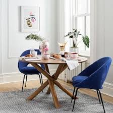 Round dining tables are a perfect fit for small dining rooms. Jax Round Dining Table