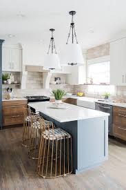 brown oak cabinets with gray island