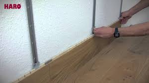 You can use laminate flooring on walls to create unique accents in your home. Installation Instructions For Floor On The Wall Haro Parquet English Youtube