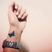 Little Wrist Tattoo Of A Butterfly On Nikki Butterfly Wrist Tattoo Blue Butterfly Tattoo Small Wrist Tattoos