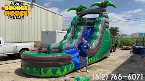 Austin Bounce House Rentals Rainforest Water Slide Rental First Look In 2020 Water Slide Rentals Bounce House Rentals Water Slides