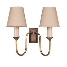 These reading lights are easy to adjust, stunning to look at, and provide more than enough light to enjoy a good book. Brass Double Rowsley Wall Lights Jim Lawrence