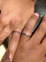 Wedding Date On Our Ring Finger Thanks Peter You Rock Yelp Ring Finger Tattoos Wedding Band Tattoo Ring Tattoo Designs
