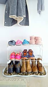 Can you hang tension rod shoe racks on a wall? Diy Shoe Storage Budget Friendly Entryway Shoe Storage Idea