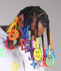 In photos, you can see that top of the dreadlocks are super matted and beads everywhere. The Designer Behind The Louis Vuitton Beads On Twitter