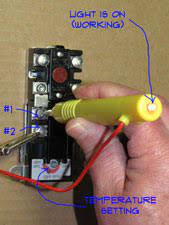 The electric breaker is a roughly 1 ft × 2 ft (30 cm × 61 cm) metal box. Testing Water Heater Thermostats Electric Water Heaters Water Heaters Plumbing Repair Topics