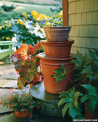 The multi pots fountain features three levels of pouring water. Pyramidal Pots Water Fountain Martha Stewart