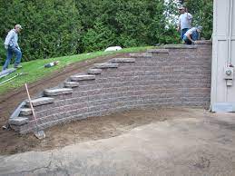 A drainage pipe is lowered down the slope, where it gets. Can You Build A Retaining Wall On A Slope