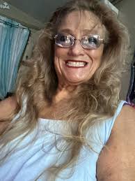 Here's Peggy Moore's obituary that should be attached to her photo.