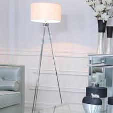 This decorative lamp features a classic white finish and a wide dish shade with a bright gold interior for a bold update to any space. Large Chrome Tripod Floor Lamp With White Cotton Shade White Tripod Lamp
