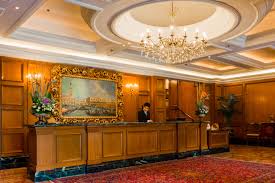 The hotel lobby features marble floors and paneled walls. Ritz Carlton Kuala Lumpur A Taste Of Malaysian Luxury No Destinations