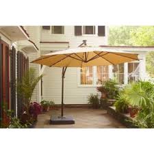 Hampton Bay 11 Ft Offset Led Patio Umbrella In Tan Uxm05201a The Home Depot Patio Offset Patio Umbrella Outdoor Patio Umbrellas