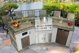 Stucco Stone Front With Porcelain Tile Counter And Bar Ledge Outdoor Kitchen Countertops Outdoor Kitchen Outdoor Kitchen Island