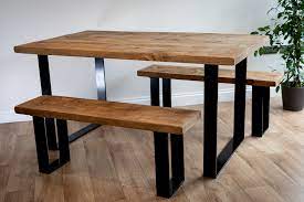 Farmhouse dining tables typically feature natural wood or distressed paint finishes. Wood Top Dining Set With Black Flat Bar Frame Fabulous Furniture Company