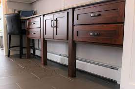 How does baseboard heat work? Dealing With A Hot Water Baseboard Heater That Just Cannot Be Moved Isn T Fun But This Solution Shows Baseboard Heating Diy Kitchen Storage Baseboard Heater