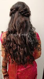 You can also add curls to your hair to complete your dreamy look. Pretty Cascading Curls Gorgeous Bridal Hairstyle By Team Swank Indian Bridal Reception Hairs Wedding Hairstyles For Long Hair Bridal Hairdo Indian Hairstyles