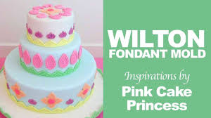 Take some icing on a spatula and drop it back down into the bowl to check for the correct thin consistency for flooding. How To Use Wilton Silicone Mold Global To Decorate Cakes By Pink Cake Princess Youtube