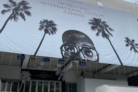 Making a mark without leaving. Photos L Affiche Du Festival De Cannes 2021 Installee Sur Le Palais Des Festivals Ce Dimanche Matin