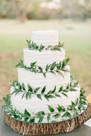 10 Ways To Use Greenery In Your Wedding Decor And Save Money Wedding Cake Greenery Wedding Cake Rustic Wedding Decorations