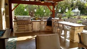 A typical concrete patio or front porch can get a major makeover by simply implementing a few easy outdoor decorating ideas, such as new furniture cushions and string lighting, or some brightly colored pots and accent statues. Austin Outdoor Kitchens Austin Decks Pergolas Covered Patios Porches More
