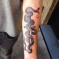 Knife Tattoo Meanings Itattoodesigns Com Knife Tattoo Tattoos Snake Tattoo