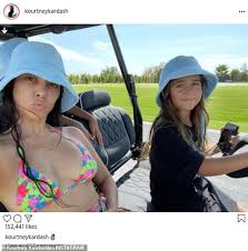 Kourtney kardashian & travis barker married? Kourtney Kardashian Wears A Colorful Bikini While In A Golf Cart Driven By Daughter Penelope Daily Mail Online