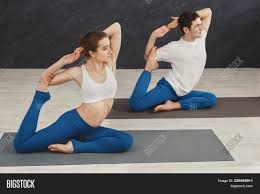 I enjoy experiencing yoga poses with my husband, as yoga not only deepens our connectedness, but it also recharges our energy and peaceful feelings throughout the day and expands our awareness with each other and the universe. Young Couple Image Photo Free Trial Bigstock