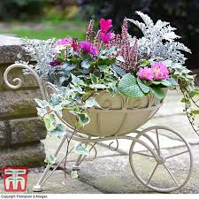 Check out our outdoor metal flower selection for the very best in unique or custom, handmade pieces from our garden decoration shops. Metal Wheelbarrow Planter Thompson Morgan