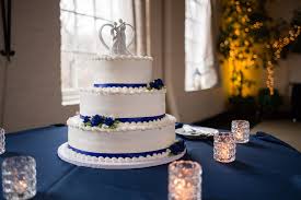 Look for one that features natural elements, colors like white, blue, purple and silver. White Wedding Cake With Royal Blue Ribbon