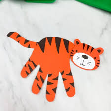 In the foreground, there is a small head, then a powerful withers, the last one. Handprint Tiger Craft For Kids