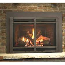 Glass media, river rock or driftwood reflected in black glass. Heat N Glo Escape I35