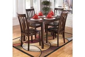Signature design by ashley freimore dining room table and stools (set of 5), medium brown. Hyland Dining Table And Chairs Set Of 5 Ashley Furniture Homestore