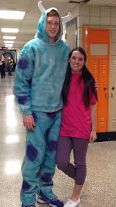 The costume comes with a bright turquoise jumpsuit that has printed fur and purple spots on the exterior. Boo And Sully Monsters Inc Costumes Monster Inc Costumes Halloween Costumes Diy Couples Couple Halloween Costumes