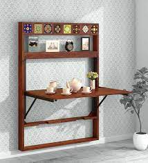 This foldable dining table is a perfect centerpiece for your breakfast nook, dinette, or small dining room. Buy Siramika Solid Wood Wall Mounted Foldable Dining Table In Honey Oak Finish Mudramark By Pepperfry Online Traditional 4 Seater Dining Tables Dining Furniture Pepperfry Product