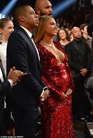 Beyoncé flaunted her baby bump in a sparkling, plunging crimson gown at the 2017 grammys after lighting up the stage at los angeles' staples for the stunning set, the destiny's child alum showed off her burgeoning belly in a shimmering gold dress paired with an intricate headpiece. Pregnant Beyonce Squeezes Bump Into Tight Dress At Grammys Daily Mail Online