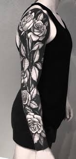 All Black Arm Sleeve Tattoo These Striking Solid Black Tattoos Will Make You Want To Go All In Solid Black Tattoo Black Tattoos Black Flowers Tattoo