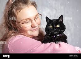 EDITORIAL USE ONLY Jodie Gates from High Wycombe, with her pet cat Jem, who  it's been announced, is a finalist in the 'Family Fur-ever' category of  this year's Cats Protection National Cat