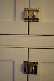 If you're designing a new kitchen or updating an existing one, you can add some great visual impact with kitchen cabinet door handles and knobs. House Tour Cabinet Latch Kitchen Cabinet Doors Kitchen Cabinets