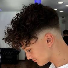 Keep your curls voluminous and bouncy to get a bigger contrast between them and the fade. 20 Best Hairstyle For Big Forehead Male Curly Hair Styles Curly Hair Men Curly Hair Fade