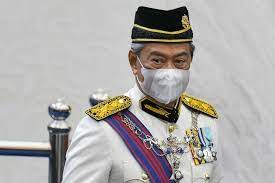 An electronic shop staff wearing a face mask watches live broadcast of malaysian prime minister muhyiddin yassin speak at a shopping outlet in kuala lumpur. Malaysia Pm In Home Quarantine After Officer Infected Asia News China Daily