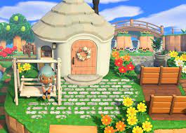The front of her face is covered in 5 coral freckles, and her eyes have two large eyelashes on each. Acnh Chevre S Front Yard Front Yard Design Animal Crossing Front Yard