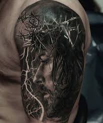 Maybe you would like to learn more about one of these? Jesus Christ Portrait Tattoo On The Left Upper Arm And