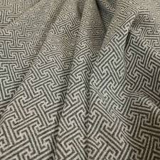 It is a modern fabric by the yard that can be used as home decor fabric, indoor fabric and outdoor fabric by the yard. Elemental Collection Geometric Pattern Soft Wool Textured Grey White Colour Upholstery Fabric Ctr 113 Yorkshire Fabric Shop