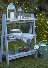 Beautiful plants need beautiful planters, and beautiful planters need beautiful stands. Stylish Shelving B Q S New Rural Outdoor Collection Comprises Of This 3 Shelf Shelving Unit Filled With Stunning Blooma Steel Lanterns To Quintais Diy G