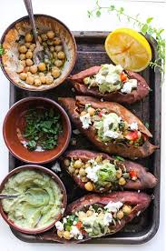 Mediterranean Stuffed Sweet Potatoes With Chickpeas Avocado Tahini Recipe Vegetarian Recipes Whole Food Recipes Healthy Recipes