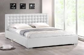 The patterns and soft colors on the rugs add a little bit of variety to this room. 9 Best White Bedroom Furniture Designs With Pictures